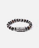 Beaded bracelet with a silver disks on a white background