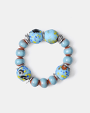 Beaded bracelet with blue and brown beads on a white background