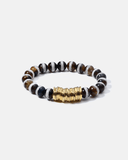 Beaded bracelet with gold accent on a white background
