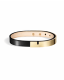 Black leather bracelet with glossy gold clasp on a white background
