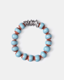 Bracelet with blue and brown terracotta beads with silver spacers on a white background