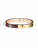 Brown leather bracelet with glossy gold clasp on a white background