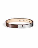 Brown leather bracelet with glossy silver clasp on a white background