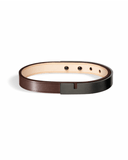 Brown leather bracelet with matte black clasp on a white background