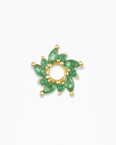 Gold and green flower-shaped charm spacer on a white background