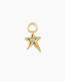 Gold star-shaped charm with an opal stone on a white background