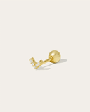 Gold stud earring with small clear stones on a white background