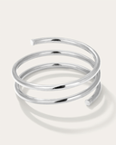 Large silver spiral bracelet on a white background
