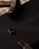 Close up of a polished chain necklace for men centered with a brilliant cubic zirconia stone