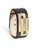 Black leather bracelet with gold clasp on a white background