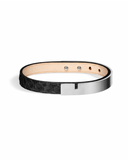 Black python leather bracelet with matte silver clasp on a white background