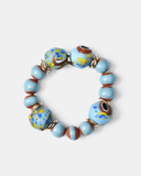 Bracelet with blue and brown beads on a white background