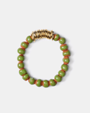 Bracelet with light green and brown terracotta beads with gold spacers on a white background