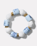 Bracelet with white and blue beads on a white background