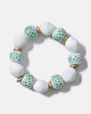 Bracelet with white and light green beads on a white background