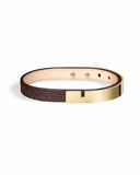 Brown python leather bracelet with glossy gold clasp on a white background