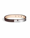 Brown python leather bracelet with glossy silver clasp on a white background