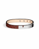 Burgundy python leather bracelet with glossy silver clasp on a white background