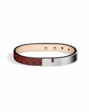 Burgundy python leather bracelet with matte silver clasp on a white background