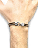 Brown Leather Bracelet with a unique clasp on a wrist against a white background