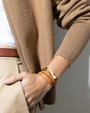Close-up of a camel leather wrap bracelet on a wrist