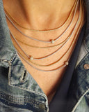 Close-up of a layered chain necklace