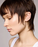 Close up of stud earrings with clear stones on a white background 