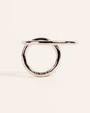 Silver ring on a light beige background