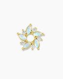 Gold and opal flower-shaped charm spacer on a white background