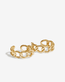 Gold chain-style ear cuffs on a white background