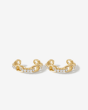 Gold chain-style ear cuffs with clear stones on a white background