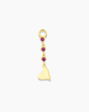 Gold charm with heart and pink stones on a white background