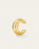 Gold ear cuff with three intertwined bands on a white background