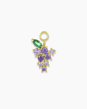 Gold grape charm with green and purple stones on a white background