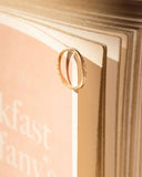 Gold ring on a book 