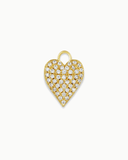 Heart-shaped charm with white stones and gold border on a white background
