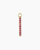 Long gold charm with pink stones on a white background