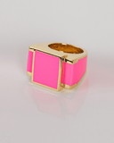 Pink square ring with gold border on a light gray background