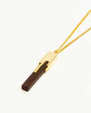 Men's Gold and wooden pendant necklace on a white background