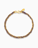 Purple and gold silk braided bracelet on a white background