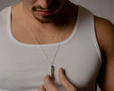 a man showcasing a stylish necklace