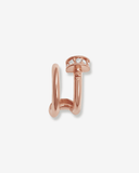 Rose gold earring with stones on a light gray background