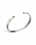 Silver bangle bracelet on a white background