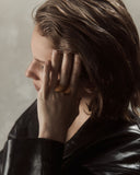 Woman wearing a gold ring 