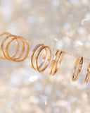 Gold rings on a light background