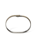Brass bracelet on a white background