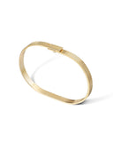 Gold bracelet on a white background